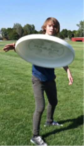 Student throwing frisbee